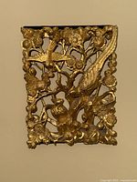 Full front view of gilded carved wood panel.