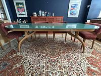 Full front view showing green painted top and sculptural base