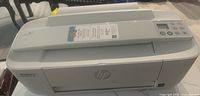 Front angled view of white HP DeskJet 3772 showing overall condition and structure.