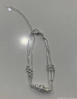 Full view of the .925 silver multi-strand bracelet showing bead details and clasp