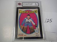 Front view of the 1971-72 O-Pee-Chee Bernie Parent Maple Leafs hockey card graded 4 VGE, showing player in goalie gear with team name and player info.
