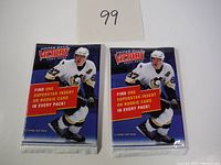Two unopened 2007-08 Upper Deck Victory hockey card packs with Sidney Crosby on front.
