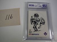 Front view of the graded Wendel Clarke rookie hockey card with detailed illustration and grading label.