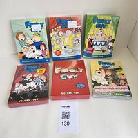 Family Guy DVD boxed sets seasons 2-7 arranged in two rows, showing front cover artwork, all sealed in original packaging.