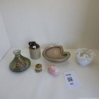 Photo showing all six vintage and antique decorative items displayed on a white surface with a lot number card visible.