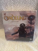 Front of box featuring fantasy armored figure holding sword and gear staff, game title 'Bardsung: The Lost Levels'.