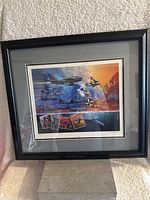 Framed NATO military poster showing the entire piece with black frame and gray matting.