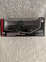 Front and side view of Motor Max 1/24 scale die cast Plymouth 1941 truck in original box.