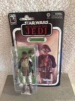 Front view of sealed Lando Calrissian Skiff Guard action figure in original packaging with clear plastic bubble and Return of the Jedi card