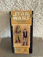 Front of the box showing Star Wars logo and artwork of Rebel Trooper figures with description of 10 piece metal figure set in 25mm scale.