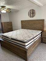 King size Haverty furniture bed frame with optional mattress, showing headboard, footboard, and mattress surface.