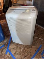 Front view of the white Maytag humidistat showing the entire appliance including vented front panel and control panel on top.