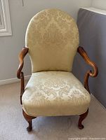 Front view showing overall form, upholstery and wood frame