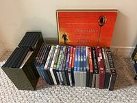 Photo of DVD collection including Jack Benny box set and various DVDs lined up