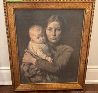 Front view of framed mother and child painting showing detailed image and ornate wood frame.