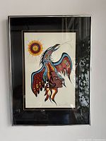 Full view of the framed lithograph showing the Thunderbird design with Indigenous art styles and vivid colors.