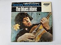 Front cover of the vinyl album showing John Mayall playing guitar with album title and branding.
