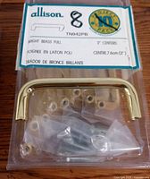 Set of 8 new bright brass pulls packaged with screws and label showing brand Allison and product code TN942PB.