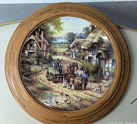 Full view of the Wedgwood 'Early Morning Milk' collectible plate in its wooden frame showing the pastoral countryside scene.
