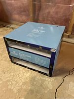 Blue box packaging of Destination Summer cafe string lights with product name and specifications visible, unopened.