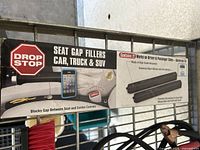 Photo showing Drop Stop seat gap fillers packaging and product details
