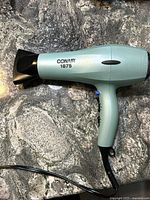 Conair 1875 blow dryer showing side profile and nozzle