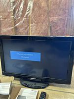 Panasonic TV showing no-signal screen, with part of the basement wall insulation visible in the background