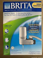 Front box image showing Brita faucet water filtration system in white and silver, highlighting quick and easy filtered water with one filter included.