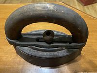 Top view showing the wooden handle attached on the cast iron base.