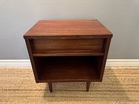 Front view of nightstand with drawer closed showing overall appearance