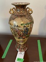 Full view of vase showing overall shape, design, and size relative to tag.