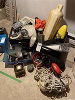 Full view of boating accessories bundle showing ropes, fender, safety kit items in containers