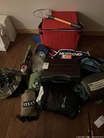 Overview of all camping gear laid out on floor