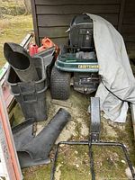 Front view of mower with bagger parts and cover
