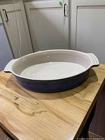Blue oval casserole dish showing exterior and handles