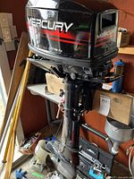 Front-left view of Mercury 4.0 outboard motor mounted on bracket