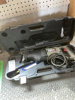 Porter-Cable Tiger Saw 9741 reciprocating saw inside molded hard plastic carrying case with extra blades and power cord.