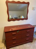 Front view of Vilas maple dresser showing six drawers and wavy bottom edge with minor surface scratches on top.