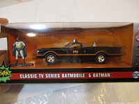 Front view of the boxed set showing Batmobile and Batman figure clearly visible, highlighting branding and condition.