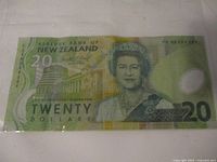 Front side of a New Zealand twenty dollar polymer banknote showing Queen Elizabeth II and Reserve Bank of New Zealand text.