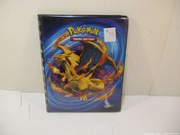 Front of the Pokemon binder featuring Charizard artwork and price sticker.