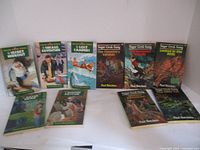 Photo showing all 10 Sugar Creek Gang books arranged in two rows on a flat surface.