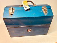 Blue metal expanding toolbox with chrome latches and handle featuring Beach Industries Limited badge on front.