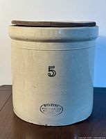 Front view of the 5 gallon Medalta stoneware crock showing the number "5" and maker's stamp.