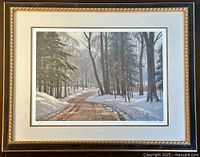 Framed art print showing winter landscape with snow-covered winding path and tall trees, signed by Frank Panabaker in lower right, numbered 88/950 on left edge.