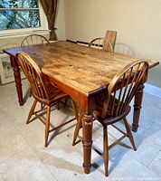Overall view of pine wood table with four matching chairs