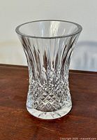 Front view of the Waterford crystal vase showing the flared opening and intricate Lismore pattern cuts.