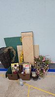 Photo showing entire bundle with cutting mats, baskets, yarn, floral arrangements, and crafting supplies