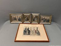 Group photo showing all five framed prints, four with silver frames and one wood framed print with mat