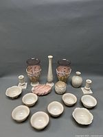 Full lot arranged showing bowls, candleholders, and vases against a gray background.